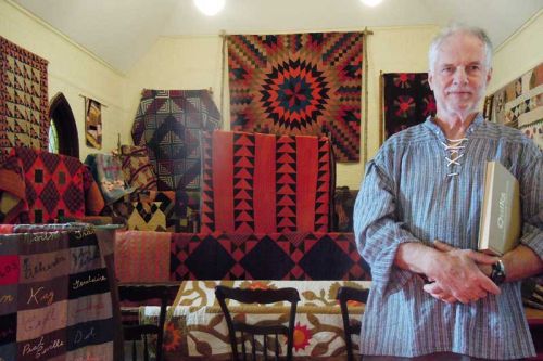 Dr. Peter Bell with his display of heritage quilts at the Trinity Quilters show in Verona on October 17.